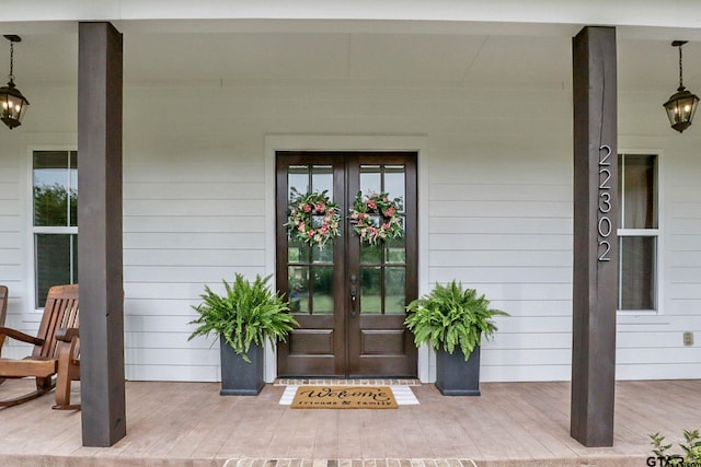 22302 County Road 422, Lindale, TX 75771 - view of exterior entry featuring french doors and covered porch