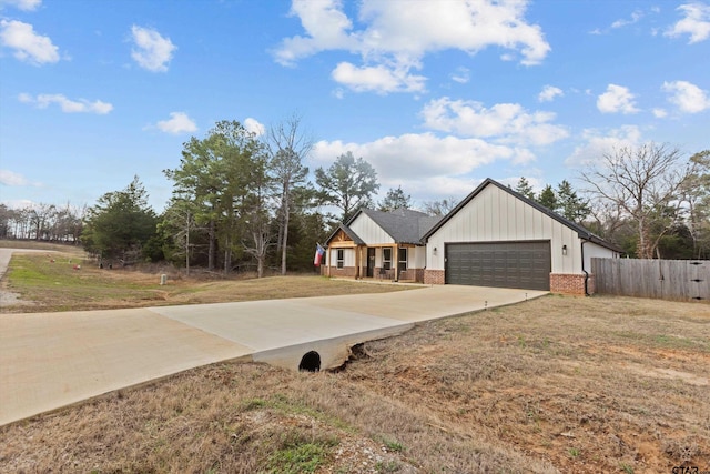 exterior space featuring a garage and a front yard