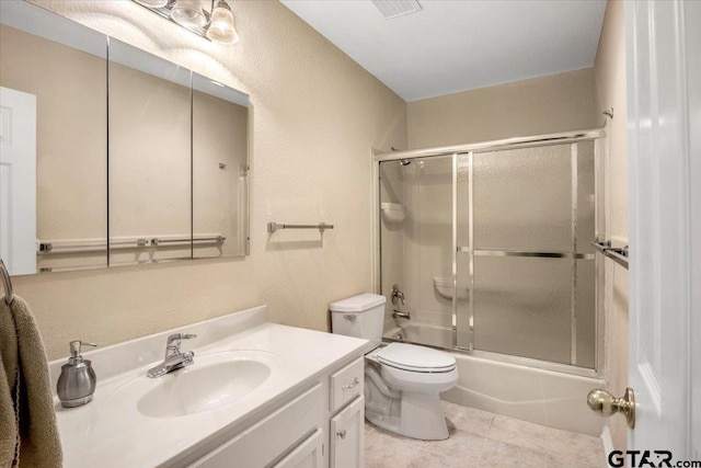 5405 Ashbury Ct, Tyler, TX 75703 - full bathroom with vanity, enclosed tub / shower combo, tile patterned floors, and a textured wall