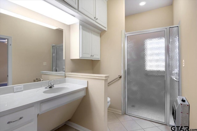 5405 Ashbury Ct, Tyler, TX 75703 - bathroom featuring a shower stall, vanity, and tile patterned flooring