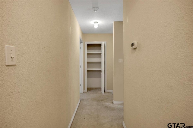 5405 Ashbury Ct, Tyler, TX 75703 - corridor featuring light colored carpet and a textured wall
