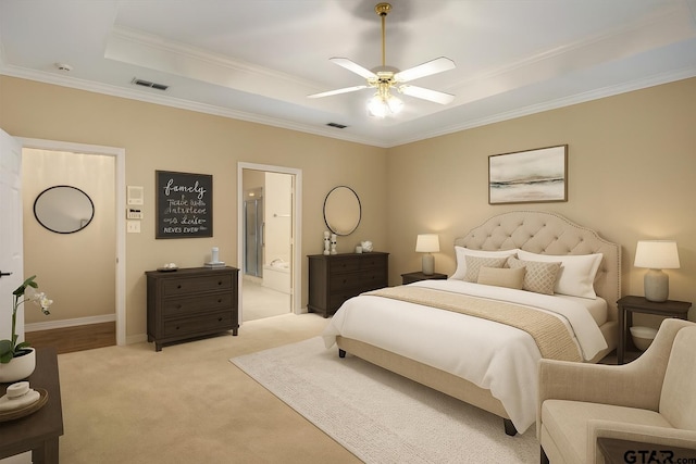 5405 Ashbury Ct, Tyler, TX 75703 - bedroom with a tray ceiling, crown molding, light carpet, connected bathroom, and a ceiling fan