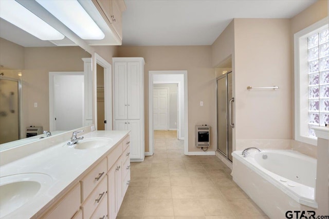 5405 Ashbury Ct, Tyler, TX 75703 - full bathroom featuring heating unit, a shower stall, double vanity, a jetted tub, and tile patterned floors