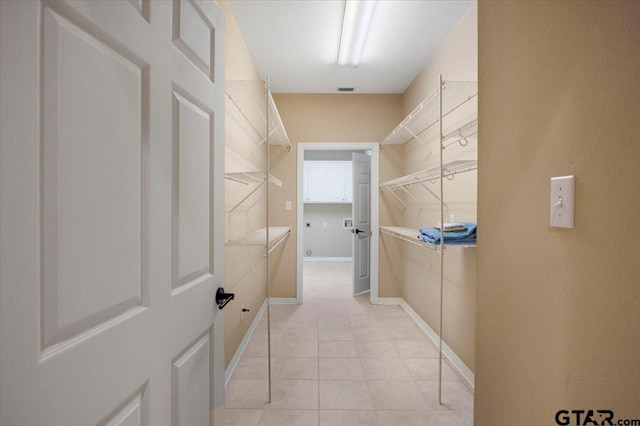 5405 Ashbury Ct, Tyler, TX 75703 - spacious closet featuring light tile patterned floors
