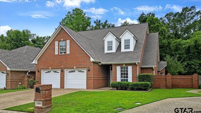 5405 Ashbury Ct, Tyler, TX 75703 - view of front of house with brick siding, a shingled roof, concrete driveway, and a garage