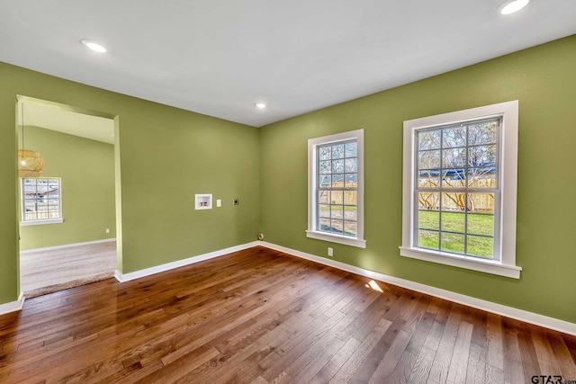 empty room with hardwood / wood-style flooring