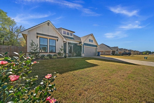 view of front of house featuring a front yard and a garage