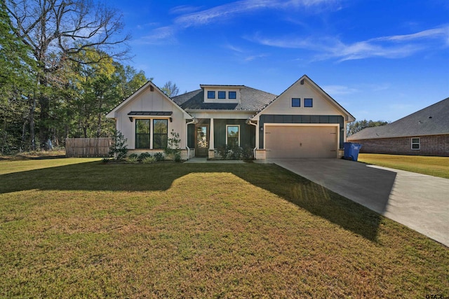 view of front of home with a garage and a front lawn