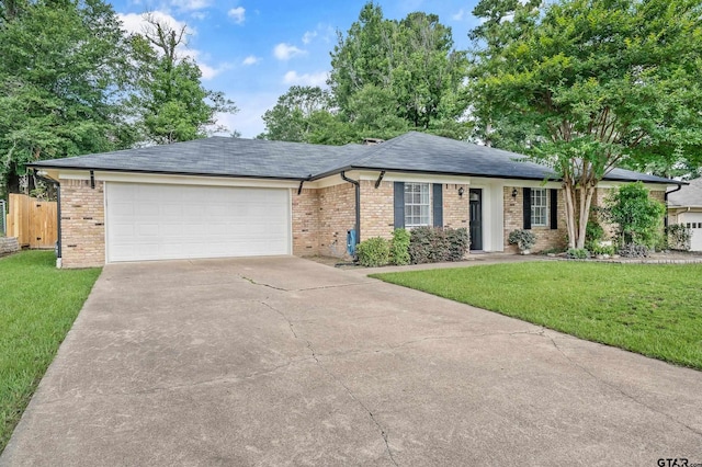 7411 Hollyoak Dr, Tyler, TX 75703 - ranch-style house featuring concrete driveway, brick siding, an attached garage, and roof with shingles