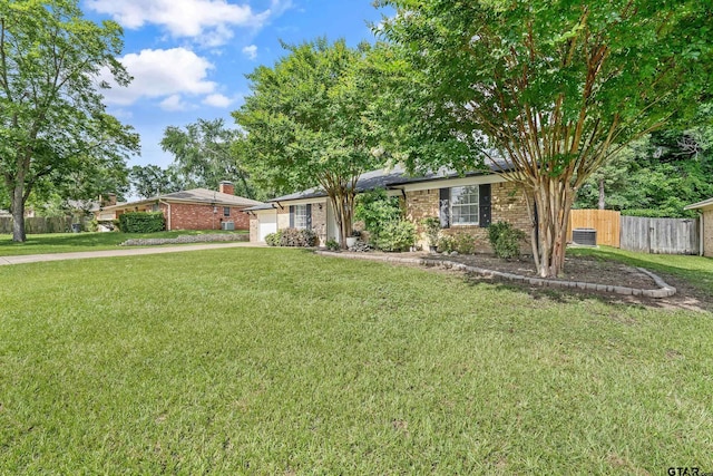 7411 Hollyoak Dr, Tyler, TX 75703 - ranch-style home with an attached garage and brick siding