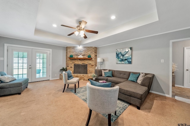7411 Hollyoak Dr, Tyler, TX 75703 - living room featuring a tray ceiling, light colored carpet, ceiling fan, recessed lighting, and french doors