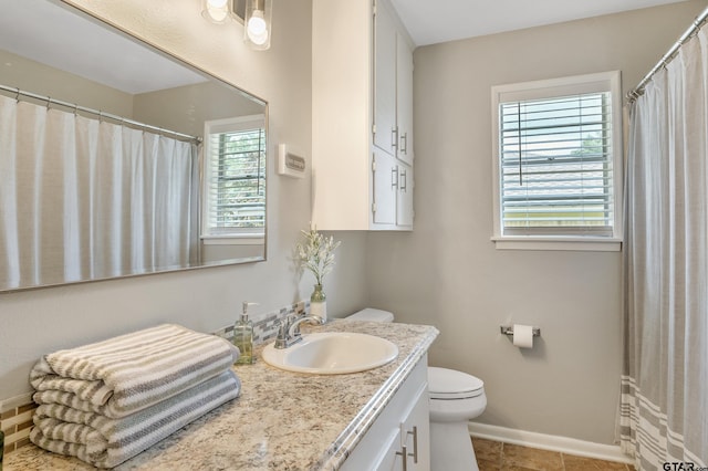 7411 Hollyoak Dr, Tyler, TX 75703 - full bathroom with vanity and tile patterned flooring