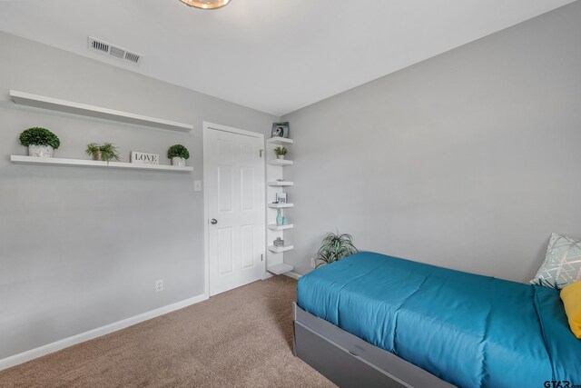 7411 Hollyoak Dr, Tyler, TX 75703 - carpeted bedroom featuring baseboards