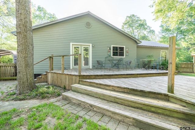 5646 Fm 346, Tyler, TX 75703 - rear view of house with a deck, fence, and metal roof
