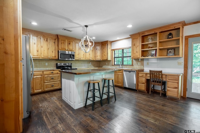 5646 Fm 346, Tyler, TX 75703 - kitchen featuring tasteful backsplash, appliances with stainless steel finishes, dark wood-style floors, and visible vents