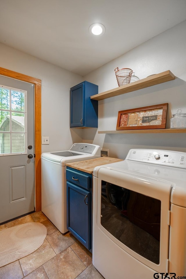 5646 Fm 346, Tyler, TX 75703 - laundry room featuring stone finish floor, cabinet space, and washing machine and dryer