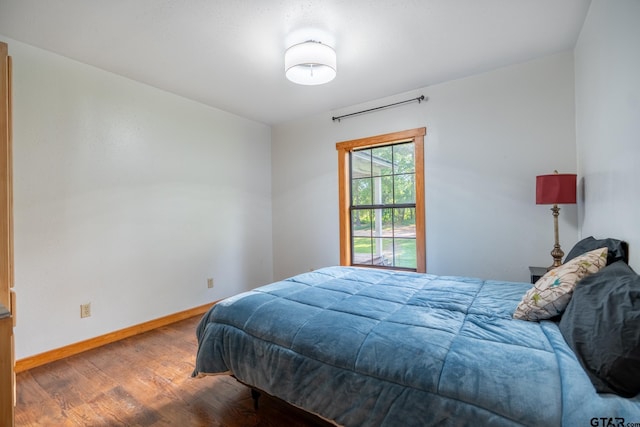 5646 Fm 346, Tyler, TX 75703 - bedroom featuring baseboards and wood finished floors
