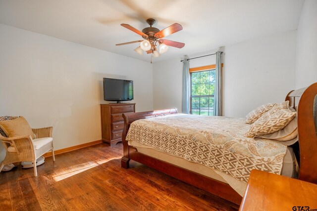 5646 Fm 346, Tyler, TX 75703 - bedroom with ceiling fan, baseboards, and wood finished floors