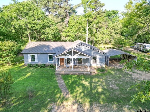 5646 Fm 346, Tyler, TX 75703 - view of front of property with a carport, a front lawn, and metal roof