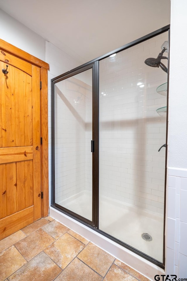 5646 Fm 346, Tyler, TX 75703 - full bathroom featuring a shower stall and stone tile floors