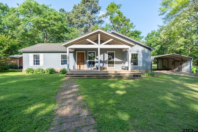 5646 Fm 346, Tyler, TX 75703 - back of property with a carport, metal roof, and a lawn