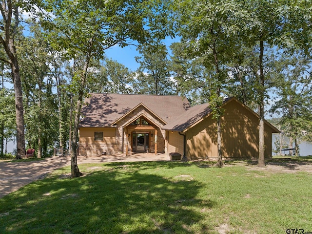 ranch-style home featuring a front yard