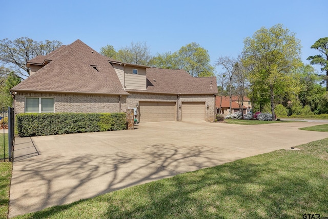 5875 Stonegate Trl, Tyler, TX 75703 - view of property exterior featuring brick siding, driveway, a shingled roof, and a garage