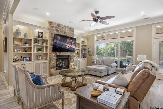 5875 Stonegate Trl, Tyler, TX 75703 - living area featuring a ceiling fan, crown molding, light wood-type flooring, a fireplace, and recessed lighting