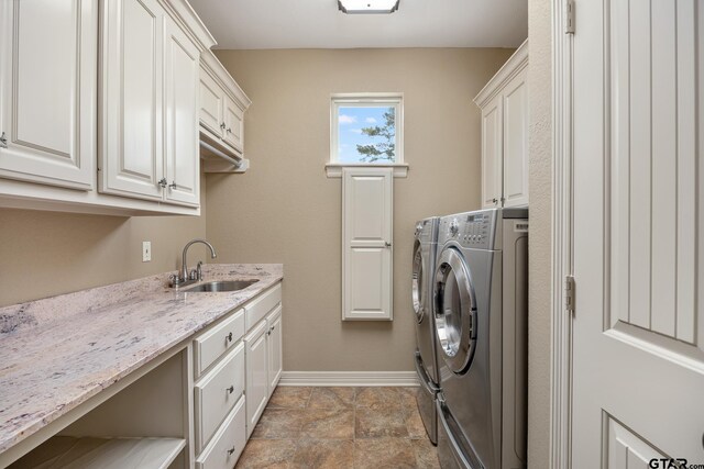 5875 Stonegate Trl, Tyler, TX 75703 - laundry room with cabinet space, independent washer and dryer, and baseboards