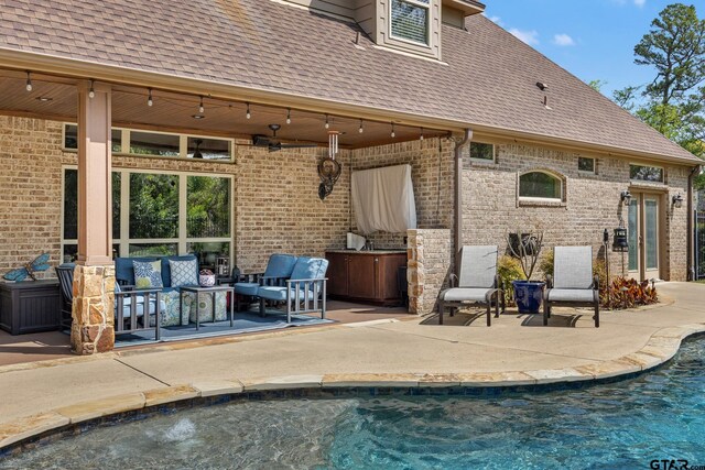5875 Stonegate Trl, Tyler, TX 75703 - swimming pool with an outdoor living space and a patio