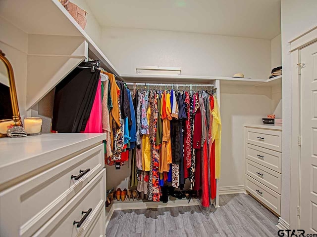 walk in closet featuring light hardwood / wood-style flooring