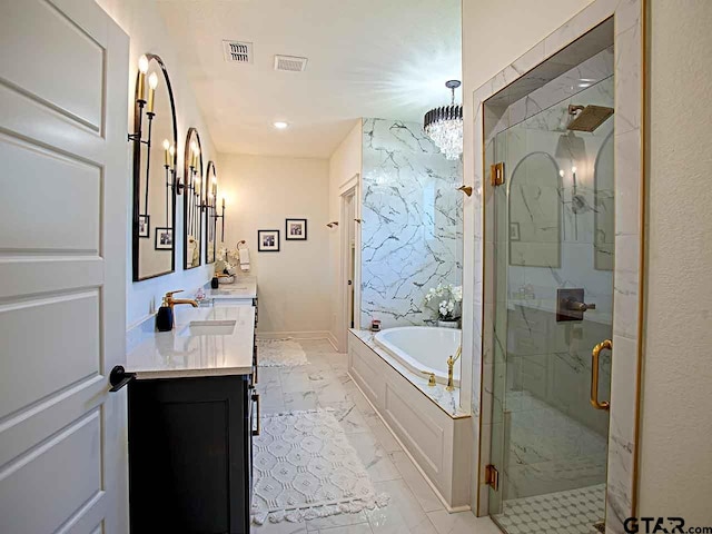 bathroom with independent shower and bath, vanity, and a notable chandelier