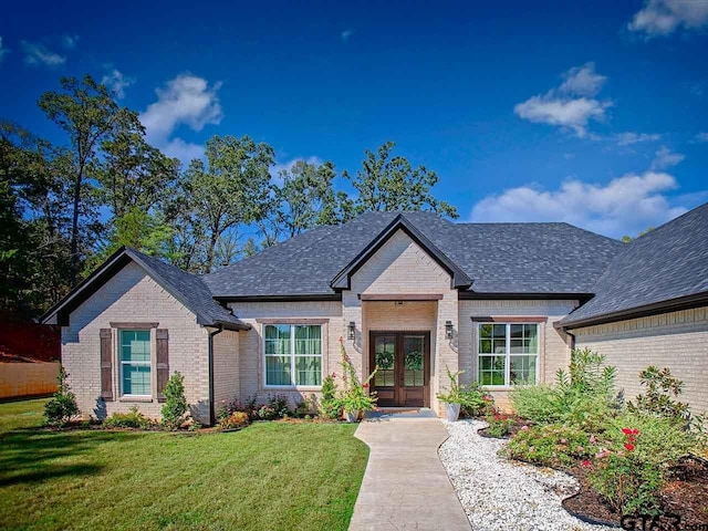 french country inspired facade with a front yard