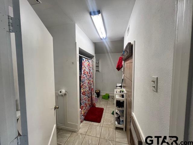 1804 E Ferdell St, Tyler, TX 75701 - corridor featuring baseboards
