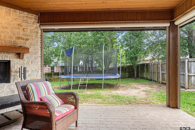 1516 Chaparrel Run, Tyler, TX 75703 - view of patio / terrace featuring a trampoline and a fenced backyard