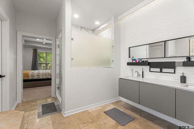 1516 Chaparrel Run, Tyler, TX 75703 - bathroom with ensuite bathroom, double vanity, baseboards, and recessed lighting