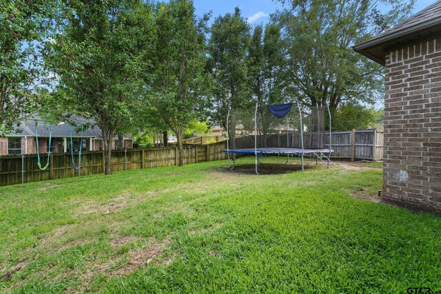 1516 Chaparrel Run, Tyler, TX 75703 - view of yard featuring a trampoline