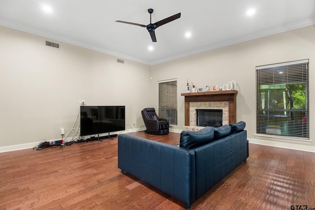1516 Chaparrel Run, Tyler, TX 75703 - living area with a fireplace, wood finished floors, ceiling fan, ornamental molding, and baseboards
