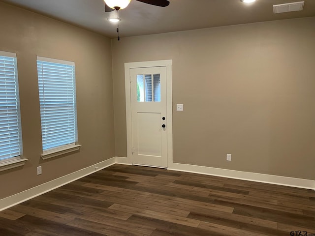 foyer with ceiling fan and dark hardwood / wood-style flooring