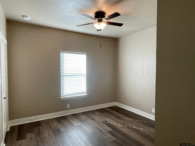 unfurnished room featuring dark hardwood / wood-style floors and ceiling fan