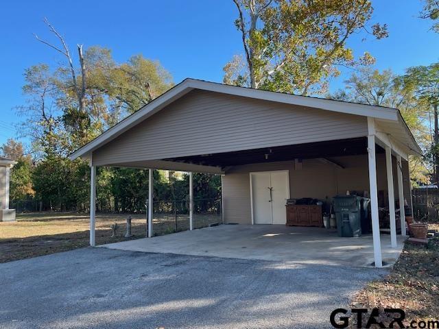 view of parking with a carport