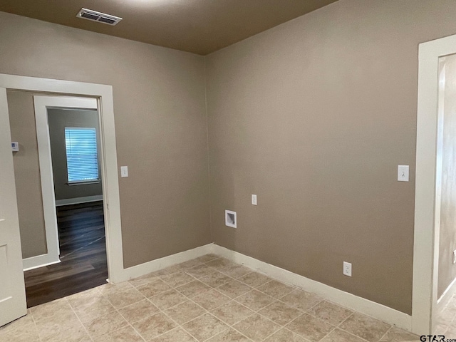 spare room with light hardwood / wood-style floors