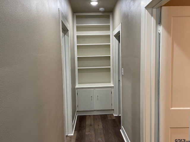 hallway with dark wood-type flooring