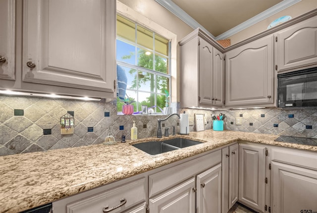 1408 Santa Fe Trl, Tyler, TX 75703 - kitchen featuring black appliances, a sink, crown molding, decorative backsplash, and light stone countertops