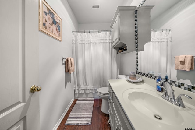 1408 Santa Fe Trl, Tyler, TX 75703 - bathroom with baseboards, toilet, vanity, wood finished floors, and a shower with curtain