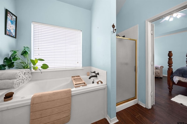 1408 Santa Fe Trl, Tyler, TX 75703 - bathroom featuring ensuite bath, a stall shower, a garden tub, wood finished floors, and baseboards