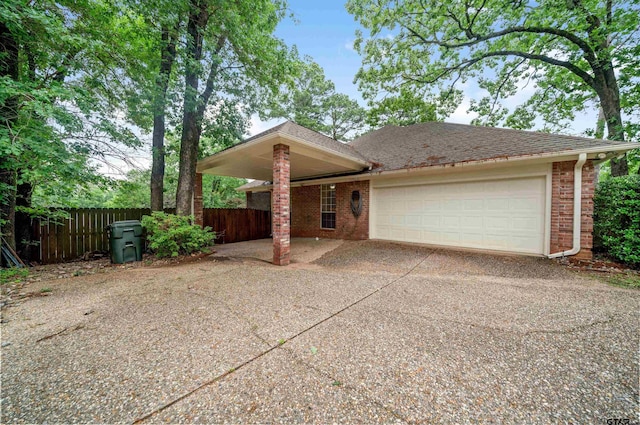 1408 Santa Fe Trl, Tyler, TX 75703 - single story home with fence, driveway, a garage, brick siding, and roof with shingles