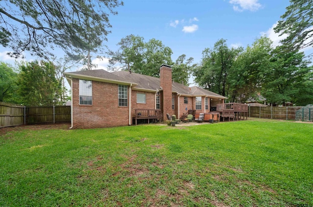 1408 Santa Fe Trl, Tyler, TX 75703 - back of house featuring a chimney, brick siding, a deck, and a patio