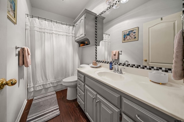 1408 Santa Fe Trl, Tyler, TX 75703 - bathroom featuring wood finished floors, vanity, toilet, curtained shower, and baseboards