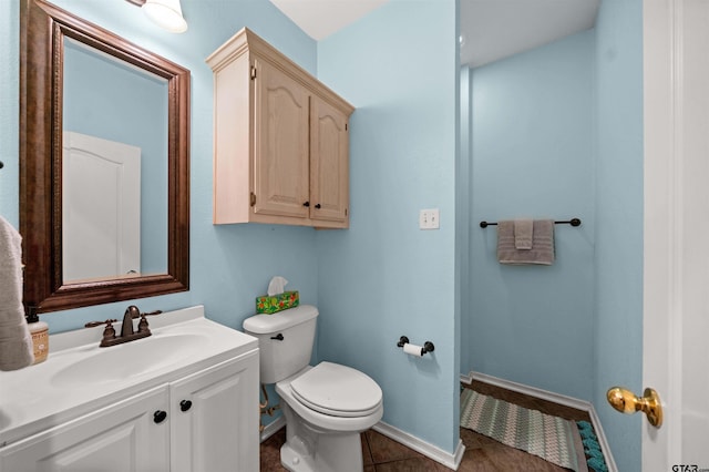 1408 Santa Fe Trl, Tyler, TX 75703 - bathroom with toilet, vanity, tile patterned floors, and baseboards